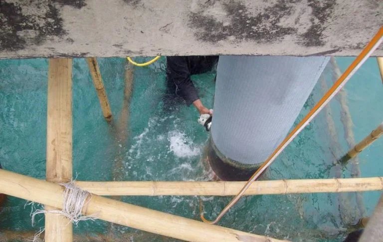 FRP Composite Wrapping — dokumentasi aplikasi di lapangan (slide p-26)